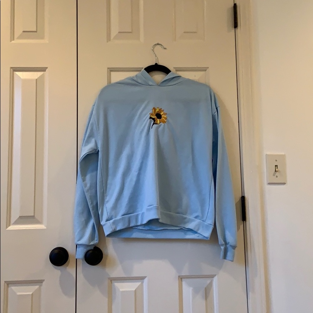 Hoodie with sunflower embroidery on it